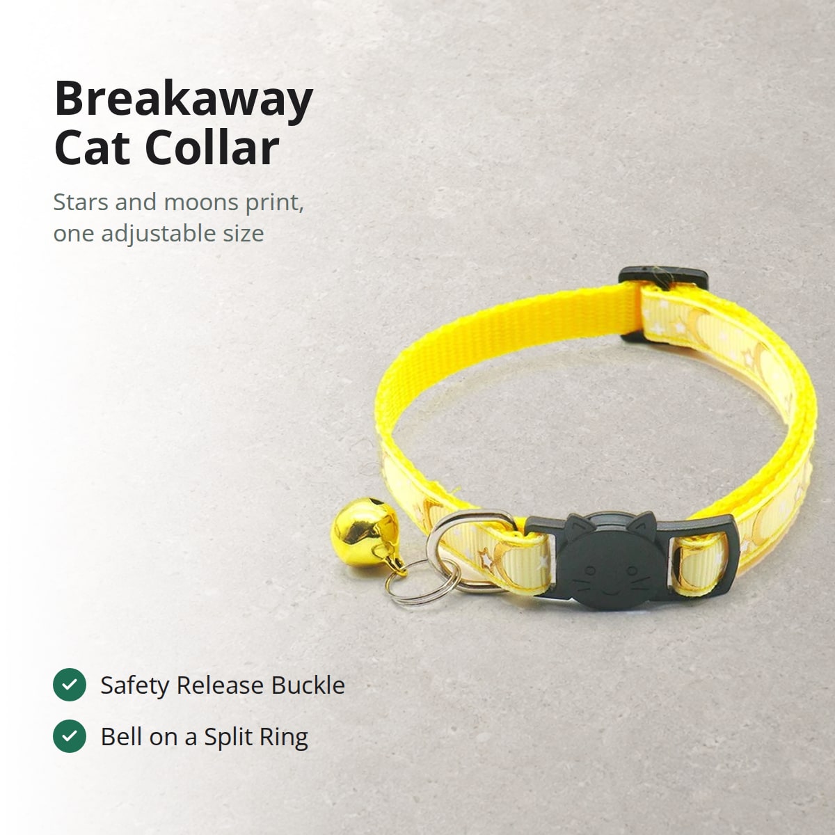 Yellow Pawhold breakaway cat collar with gold moons and stars, a black cat-face safety buckle and a gold bell